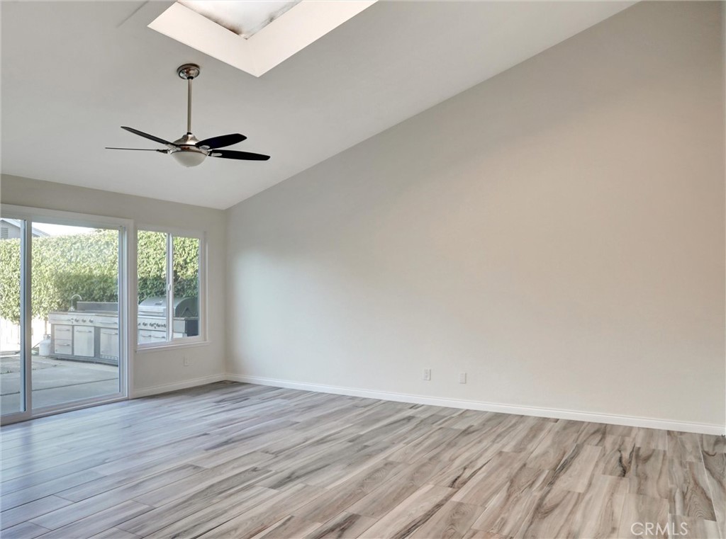 933 Carnation Avenue Costa Mesa, CA 92626 - Photo 28 of 33 a view of empty room with wooden floor and fan