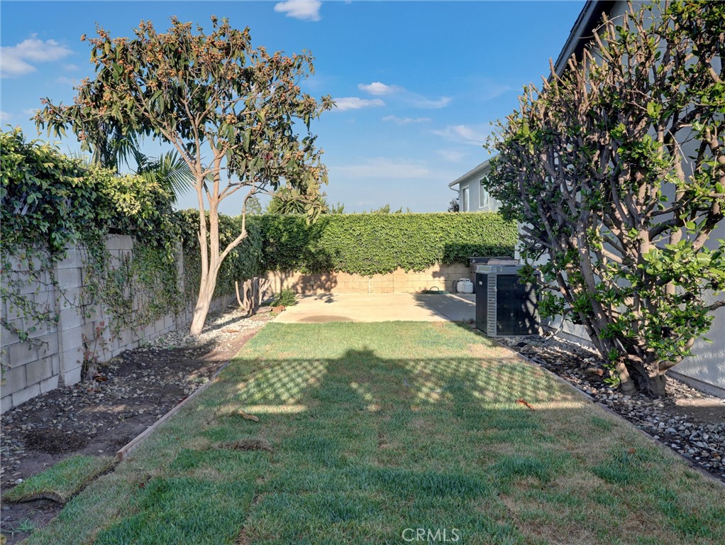933 Carnation Avenue Costa Mesa, CA 92626 - Photo 30 of 33 a view of an outdoor space and a yard