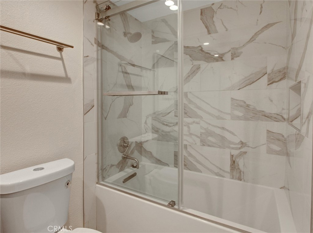 933 Carnation Avenue Costa Mesa, CA 92626 - Photo 9 of 33 a bathroom with a shower and a toilet