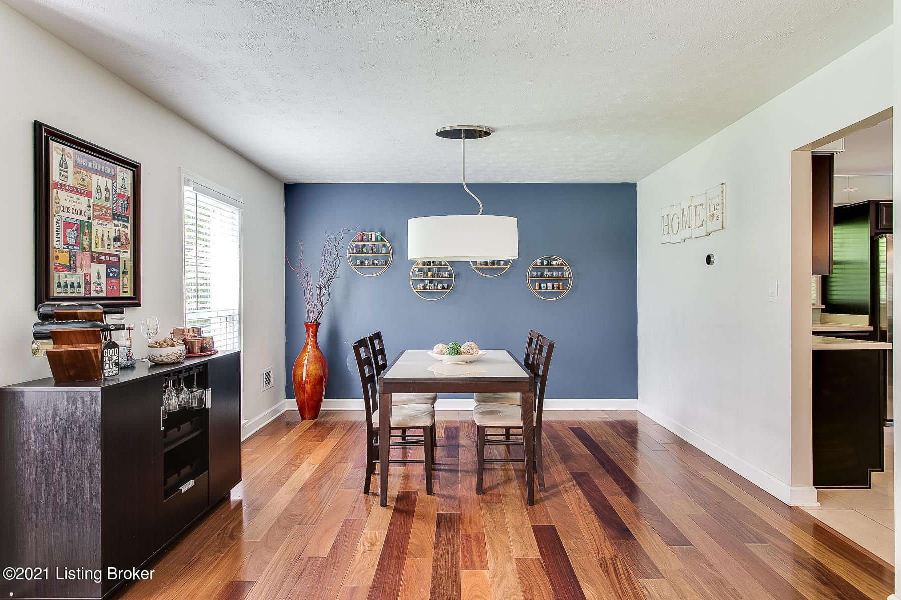 Dining area with blue accent wall
