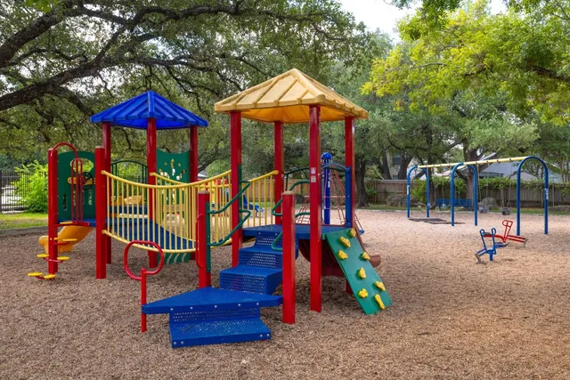 a view of a park with lounge chairs