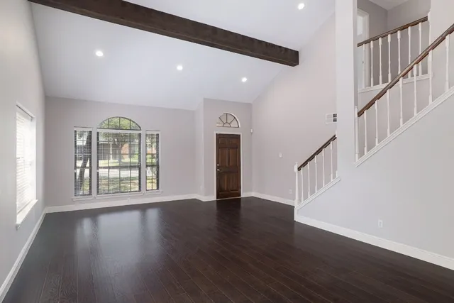 a view of an entryway with wooden floor