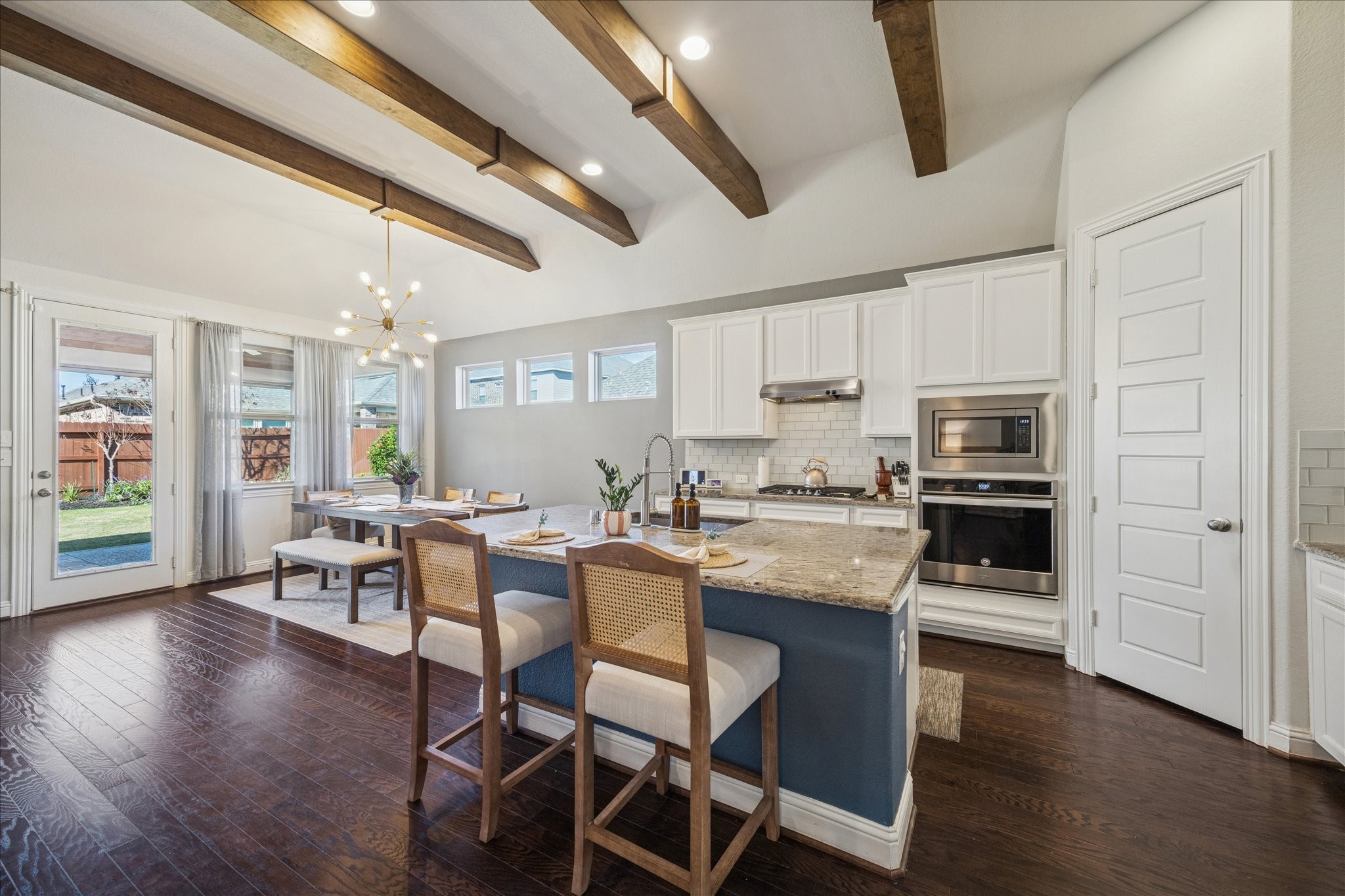 25214 Dewstone Way Porter, TX 77365 - Photo 11 of 29 As you can see the wood flooring blends seamlessly though the home.