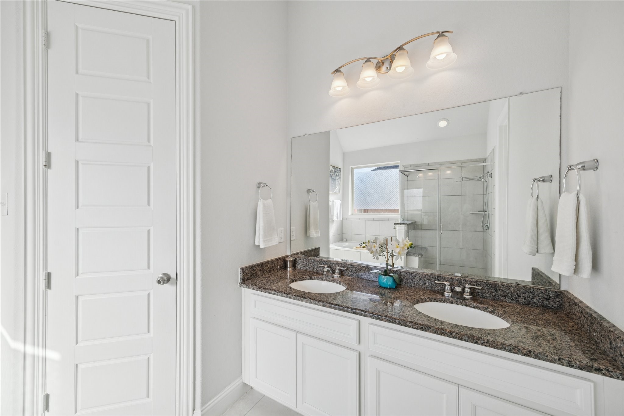 25214 Dewstone Way Porter, TX 77365 - Photo 17 of 29 Primary bathroom with double sinks and large walk in closet.
