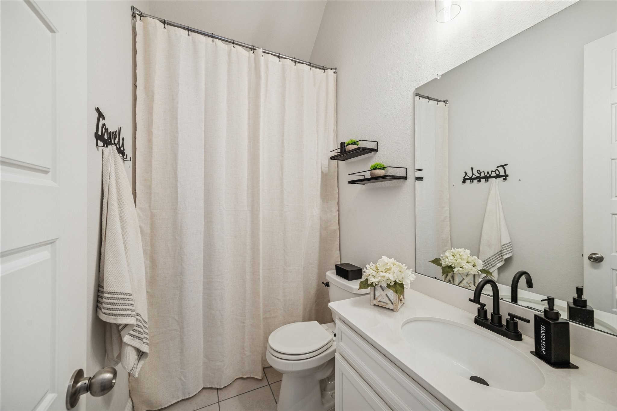 25214 Dewstone Way Porter, TX 77365 - Photo 21 of 29 Here is the full bathroom with plenty of space and a combination shower and bathtub.