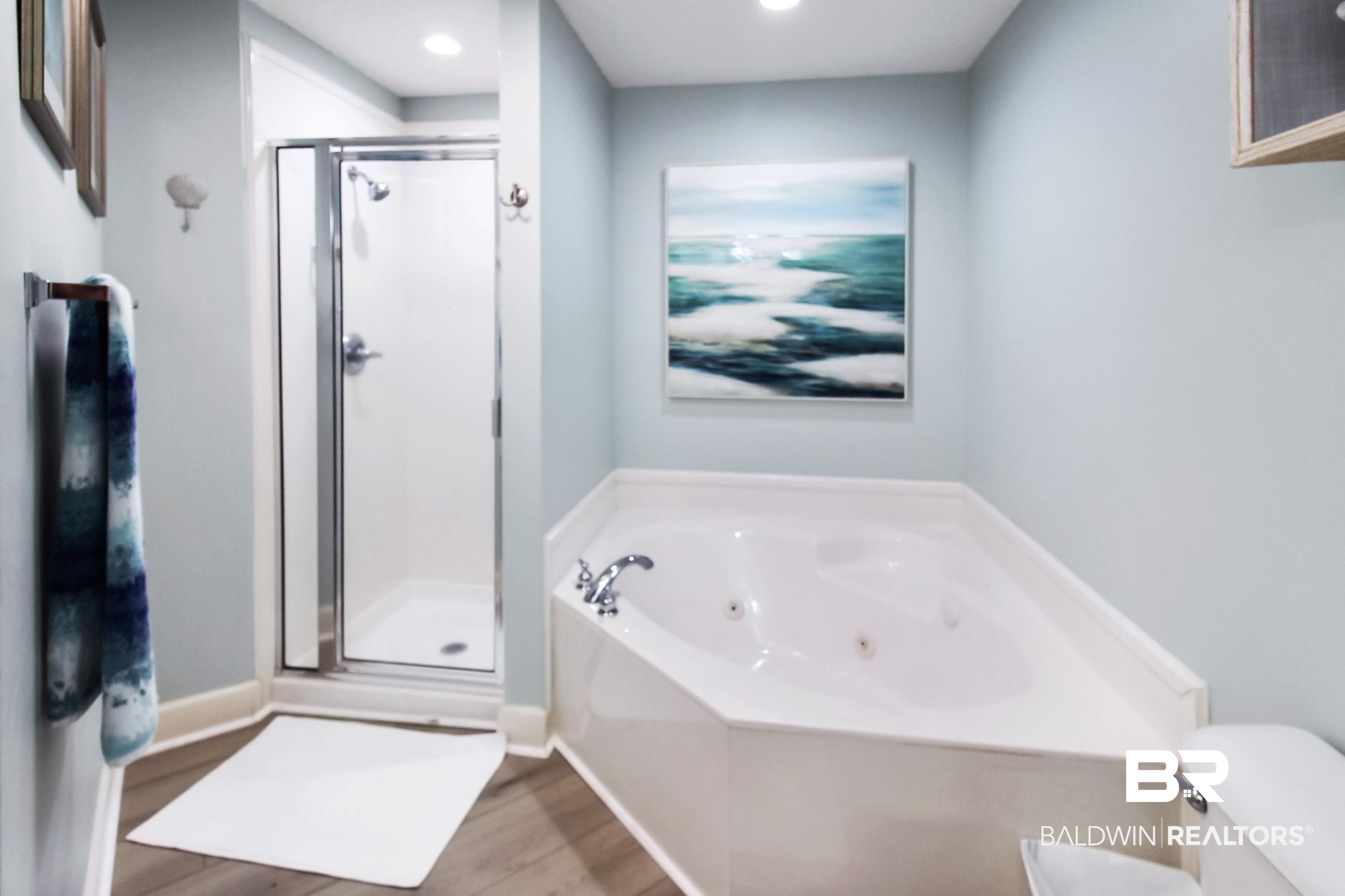27580 Canal Road, Unit 1425 Orange Beach, AL 36561 - Photo 14 of 28 Full bathroom with a shower stall, a jetted tub, wood finished floors, and recessed lighting