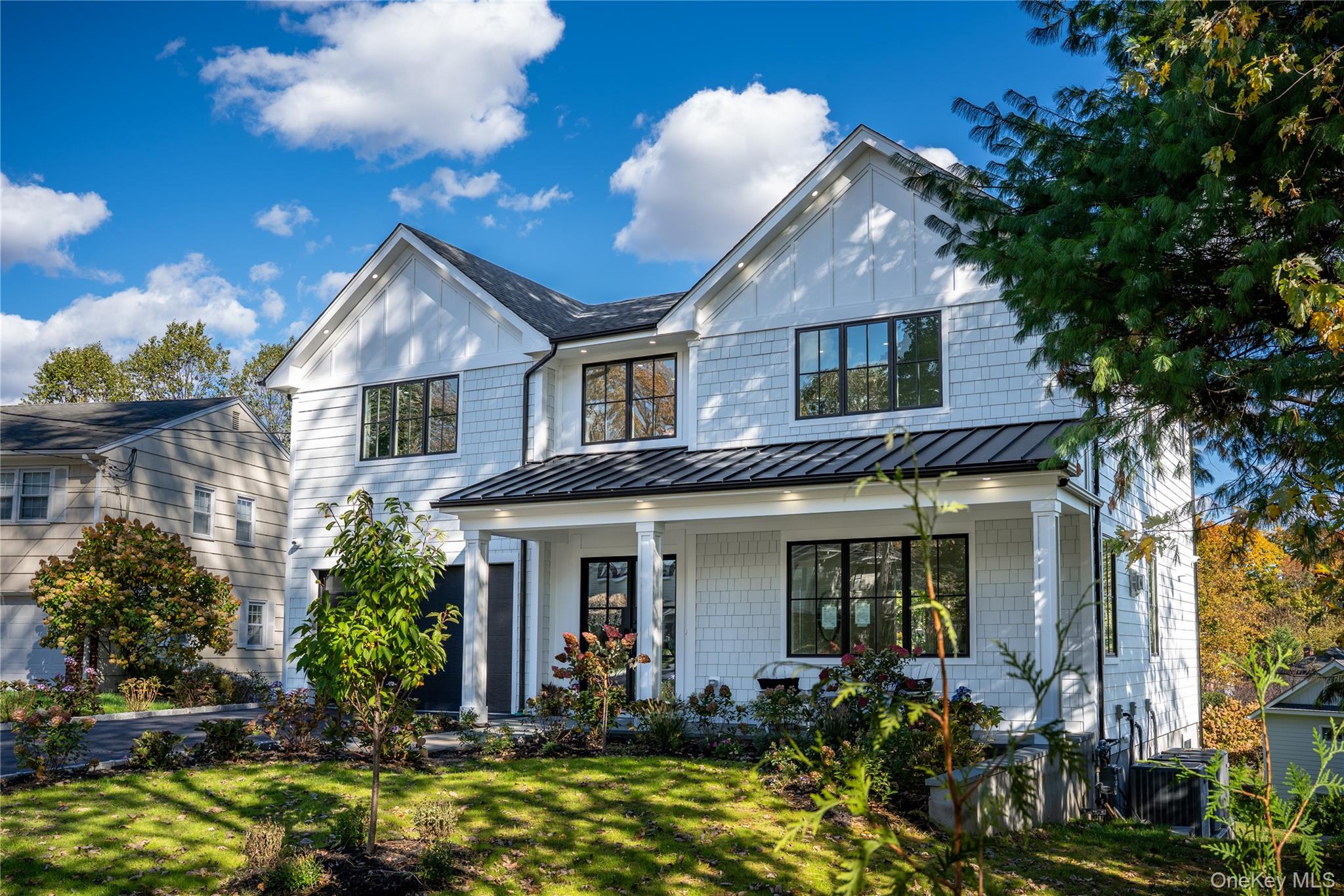 50 Franklin Avenue Rye, NY 10580 - Photo 32 of 46 a front view of a house with garden