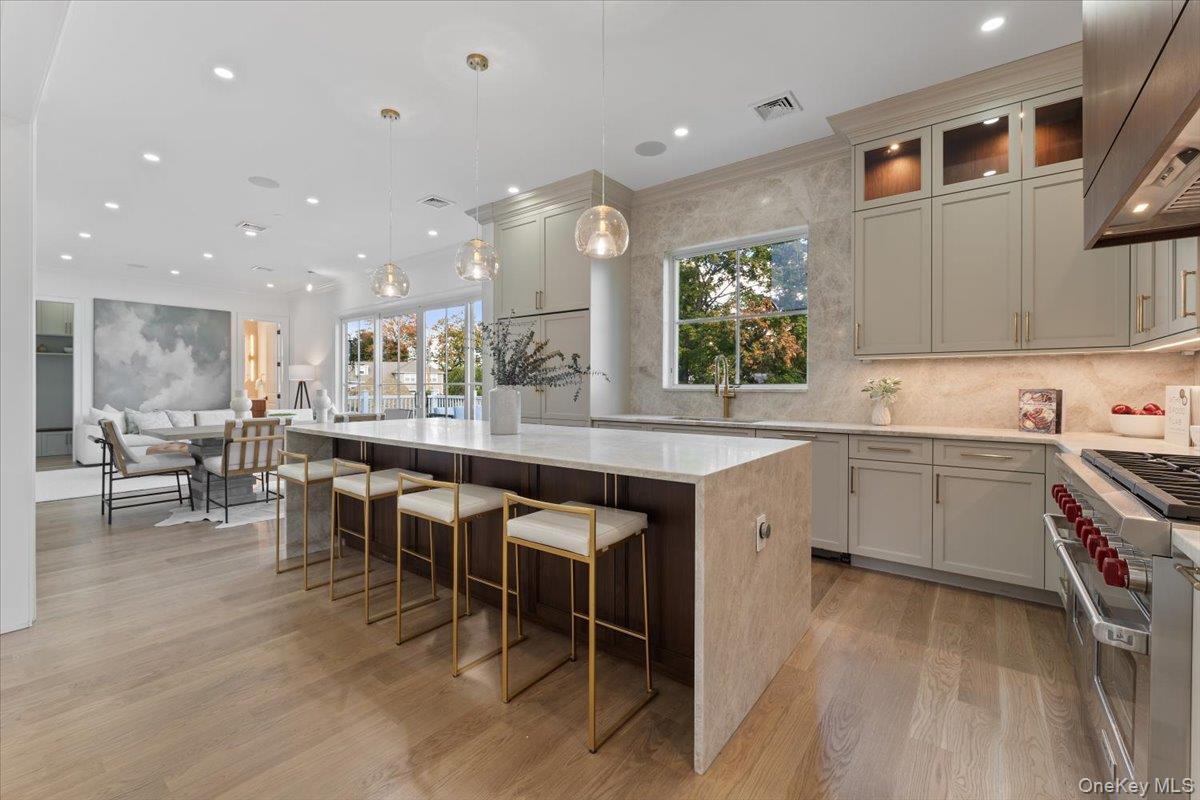 50 Franklin Avenue Rye, NY 10580 - Photo 4 of 46 a large kitchen with kitchen island a sink table and chairs