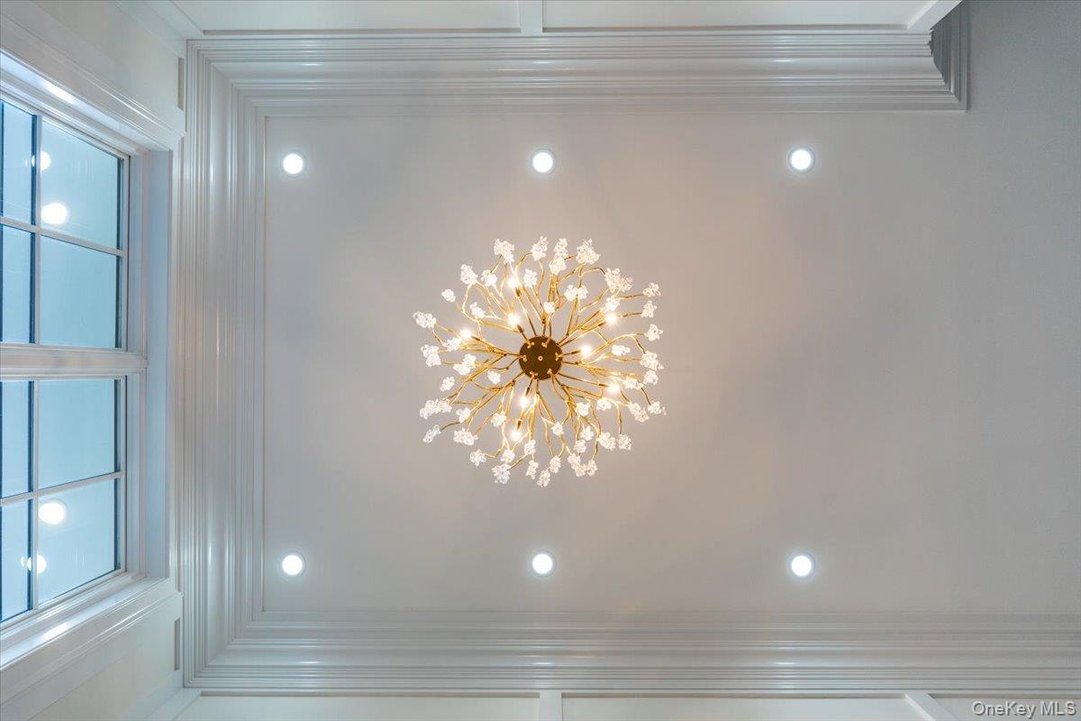 50 Franklin Avenue Rye, NY 10580 - Photo 37 of 46 a view of a room with a chandelier fan and windows