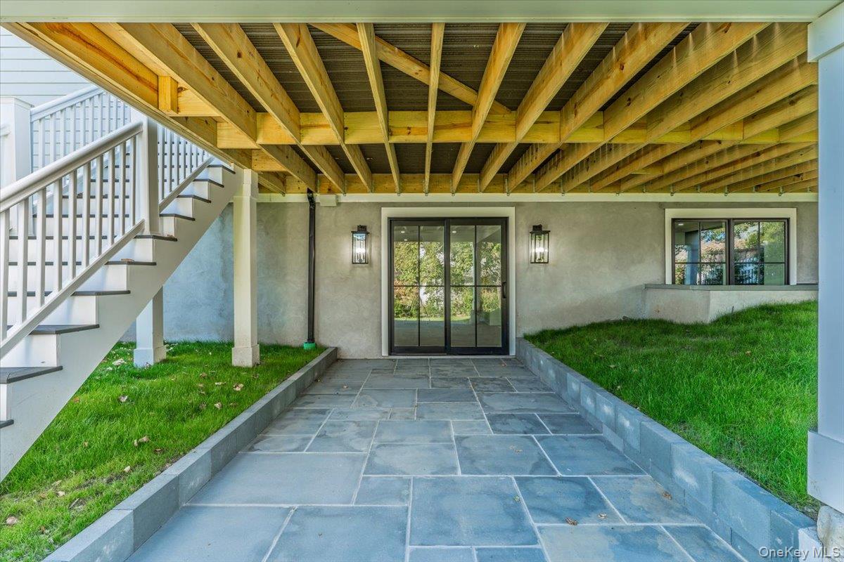 50 Franklin Avenue Rye, NY 10580 - Photo 39 of 46 a view of backyard with potted plants and wooden fence