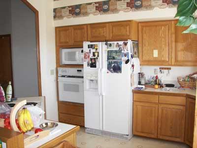 10542 Mieras Road Moxee, WA 98936 - Photo 6 of 29 a kitchen with stainless steel appliances a stove a refrigerator and cabinets