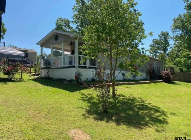 a view of a swimming pool with a yard