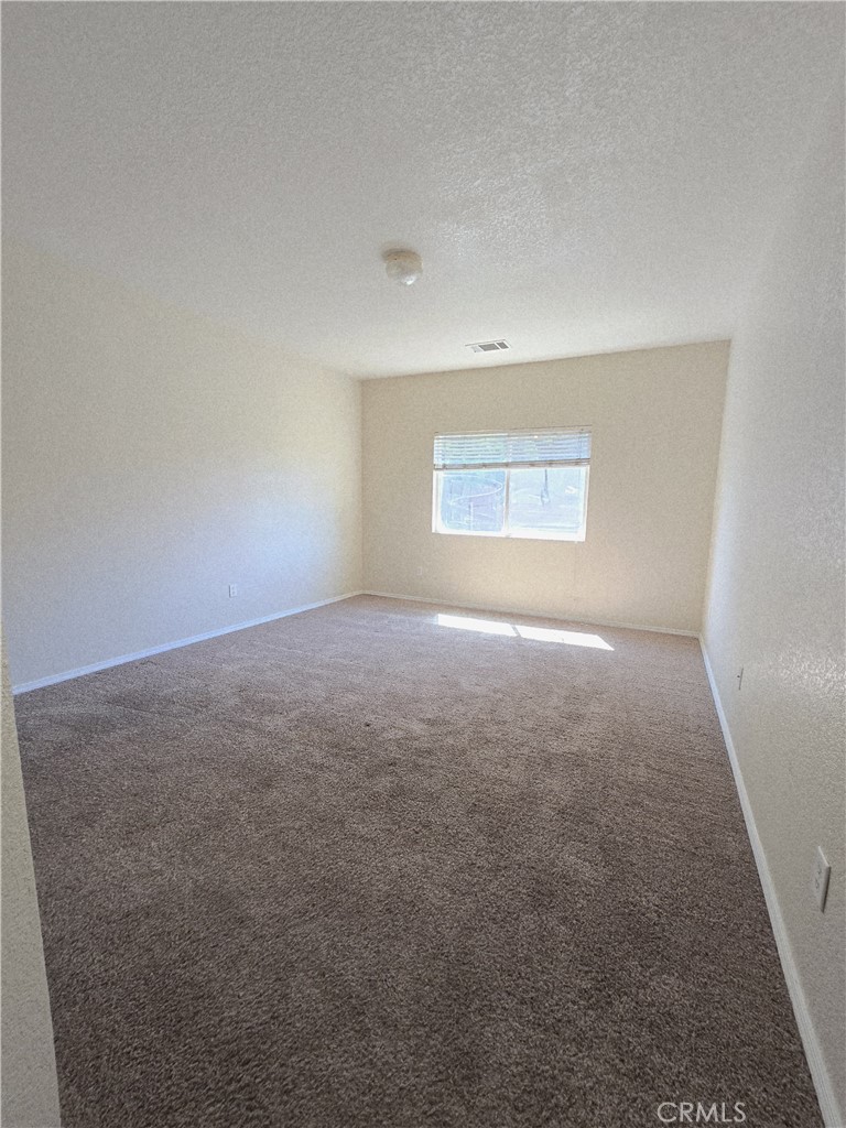 2656 Mira Court Merced, CA 95341 - Photo 12 of 23 an empty room with a empty space and windows