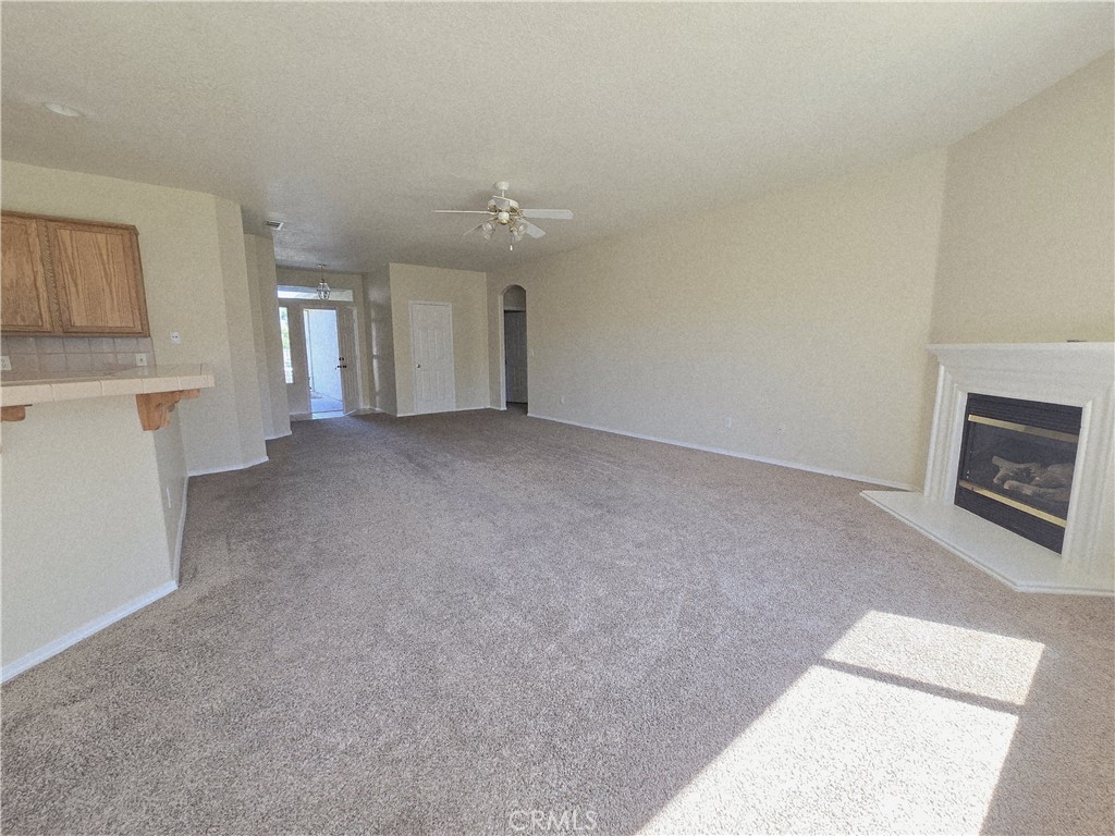 2656 Mira Court Merced, CA 95341 - Photo 7 of 23 a view of a kitchen with an empty room and fire place