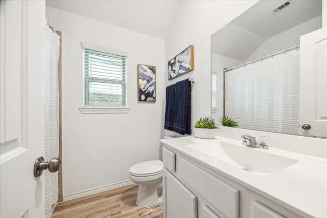a view of storage and utility room with washer and dryer