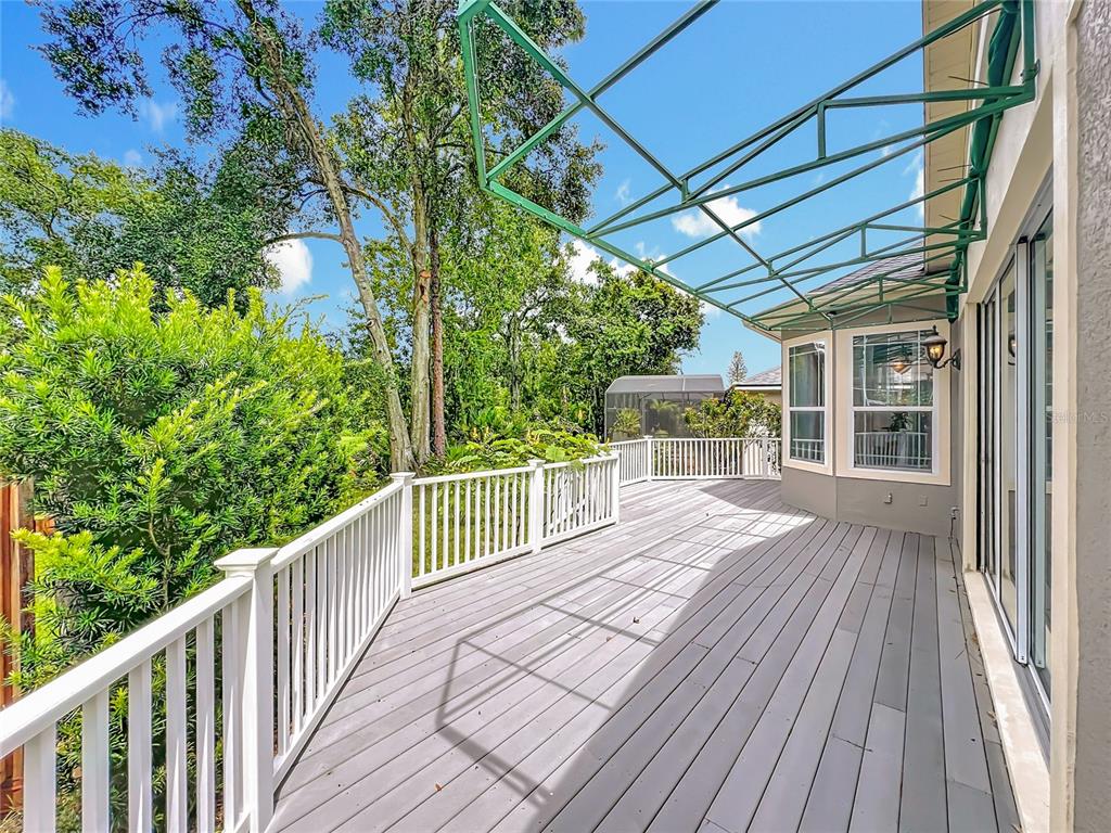 214 Chestnut Ridge Street Winter Springs, FL 32708 - Photo 11 of 68 a balcony with wooden floor