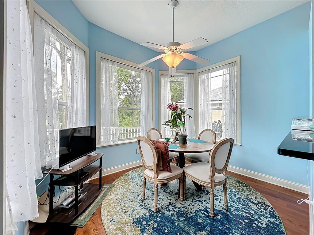 214 Chestnut Ridge Street Winter Springs, FL 32708 - Photo 22 of 68 a view of a dining room with furniture window and wooden floor