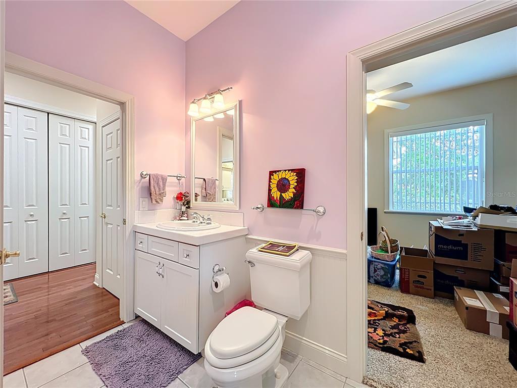 214 Chestnut Ridge Street Winter Springs, FL 32708 - Photo 46 of 68 a bathroom with a toilet a sink and a window
