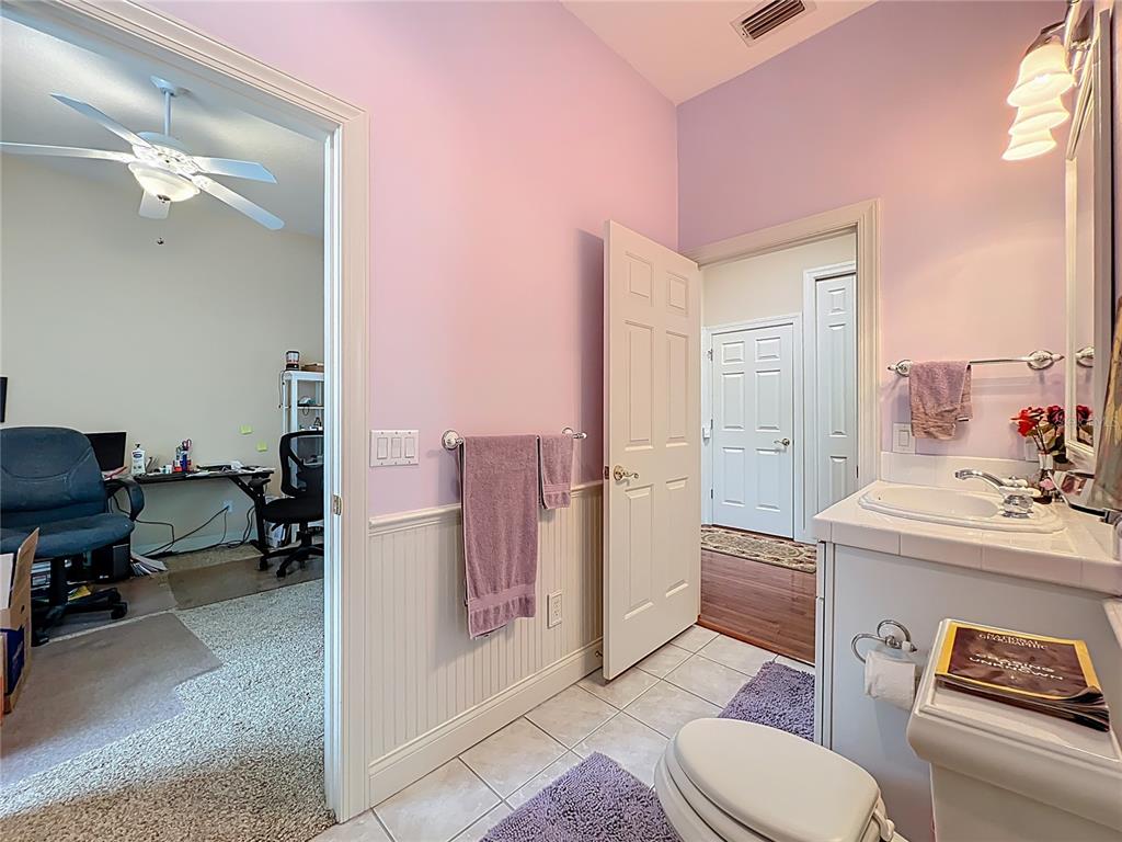 214 Chestnut Ridge Street Winter Springs, FL 32708 - Photo 47 of 68 a living room with furniture and a toilet