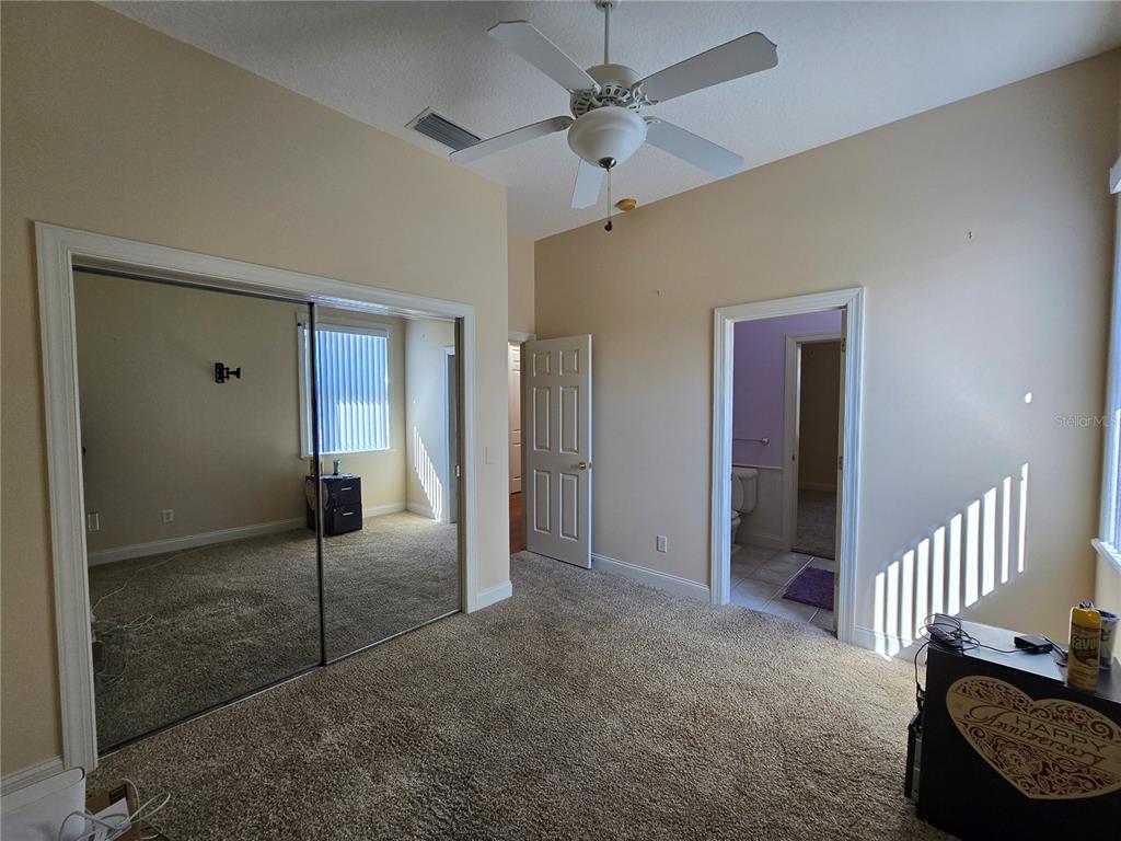 214 Chestnut Ridge Street Winter Springs, FL 32708 - Photo 48 of 68 an empty room with staircase and a ceiling fan