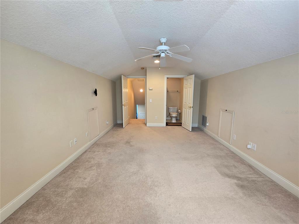 214 Chestnut Ridge Street Winter Springs, FL 32708 - Photo 53 of 68 an empty room with chandelier fan and windows