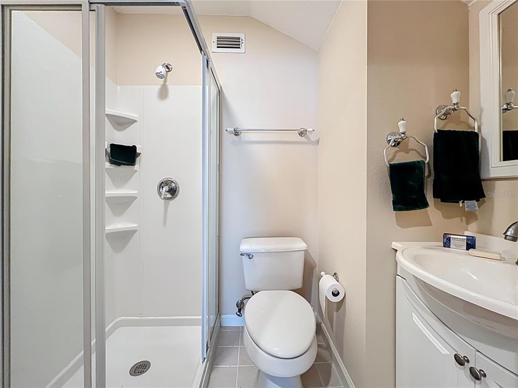 214 Chestnut Ridge Street Winter Springs, FL 32708 - Photo 55 of 68 a bathroom with a toilet a sink and shower