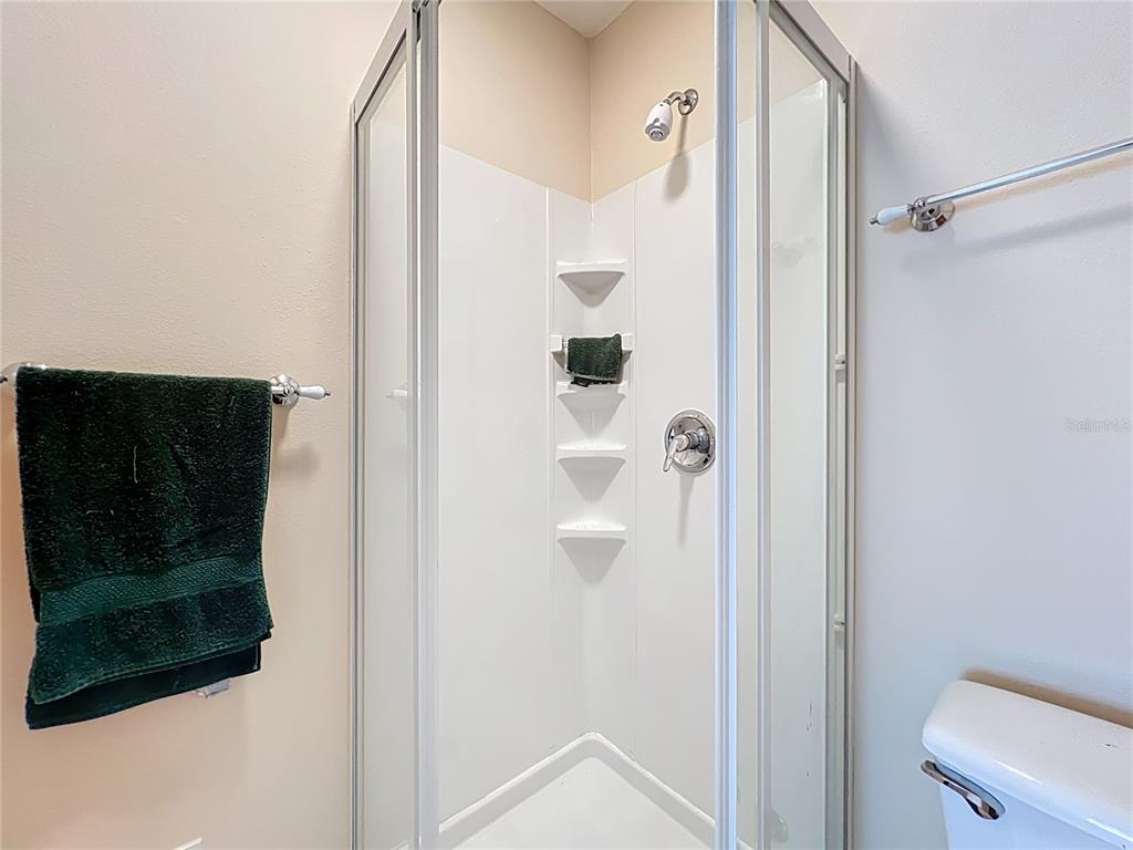 214 Chestnut Ridge Street Winter Springs, FL 32708 - Photo 56 of 68 a bathroom with a shower and a mirror