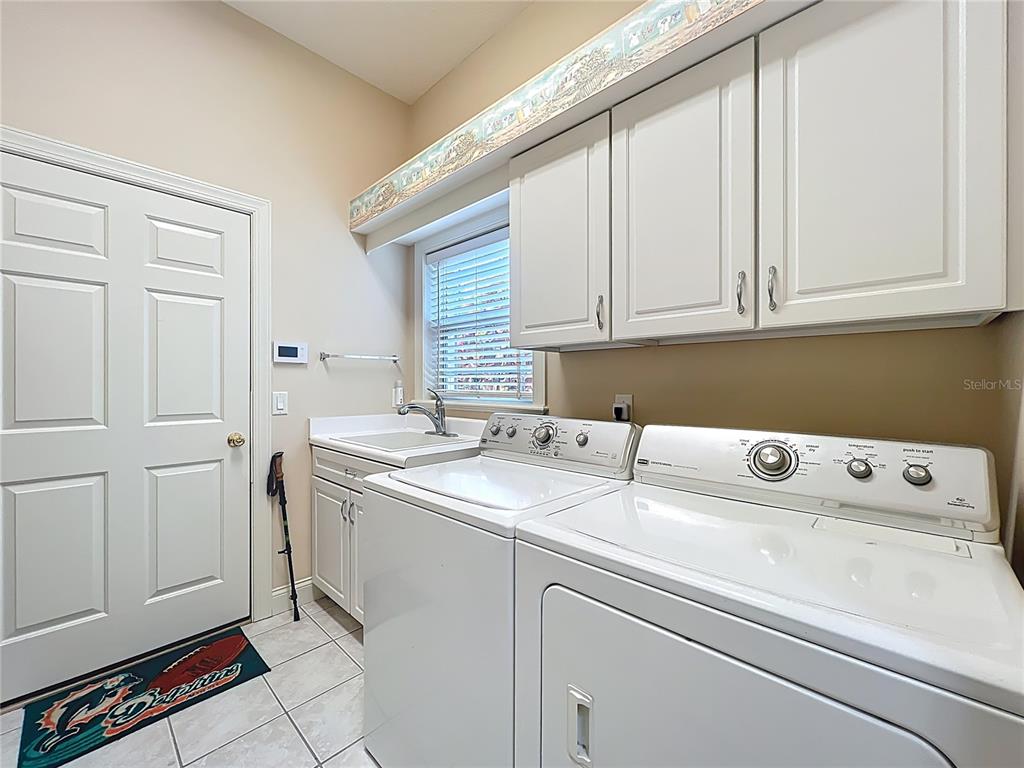 214 Chestnut Ridge Street Winter Springs, FL 32708 - Photo 57 of 68 a utility room with dryer and washer