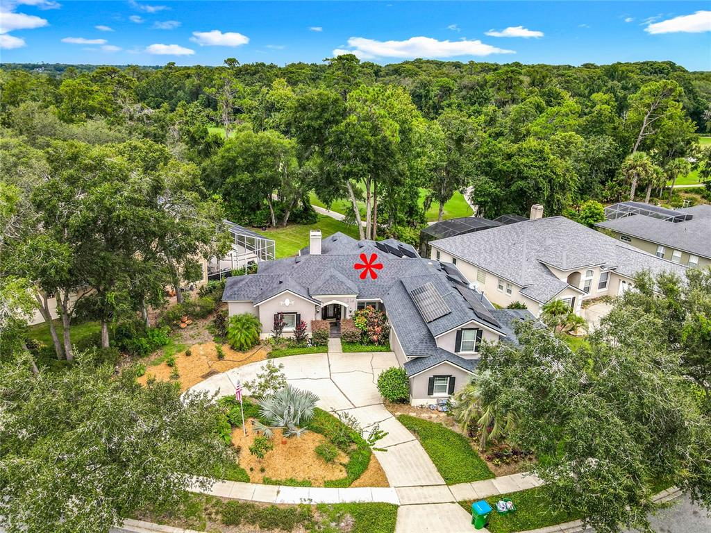 214 Chestnut Ridge Street Winter Springs, FL 32708 - Photo 59 of 68 an aerial view of a house with swimming pool and garden