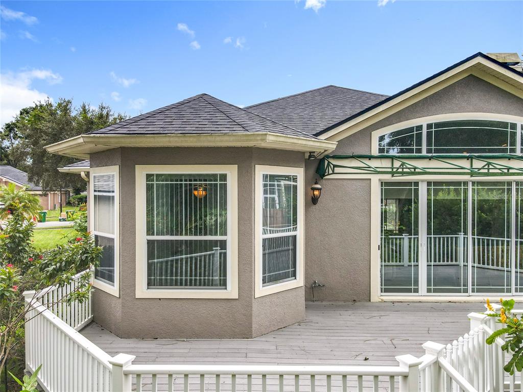 214 Chestnut Ridge Street Winter Springs, FL 32708 - Photo 61 of 68 a front view of a house with a yard and potted plants