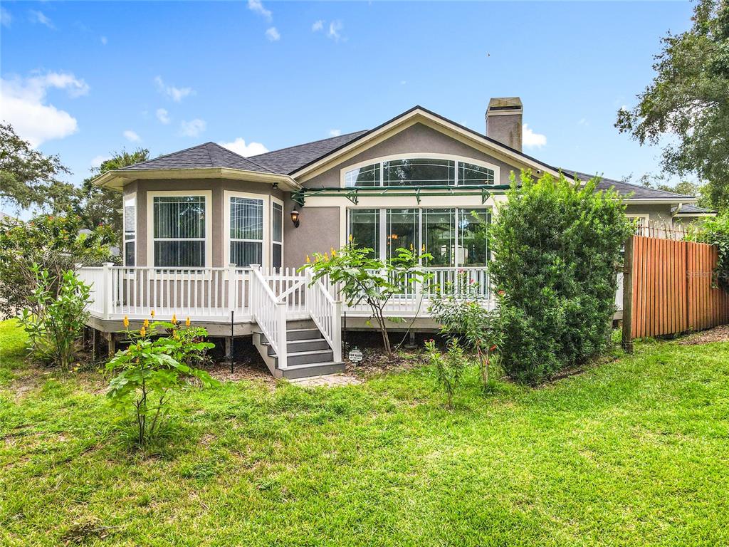 214 Chestnut Ridge Street Winter Springs, FL 32708 - Photo 64 of 68 a front view of a house with a yard table and chairs