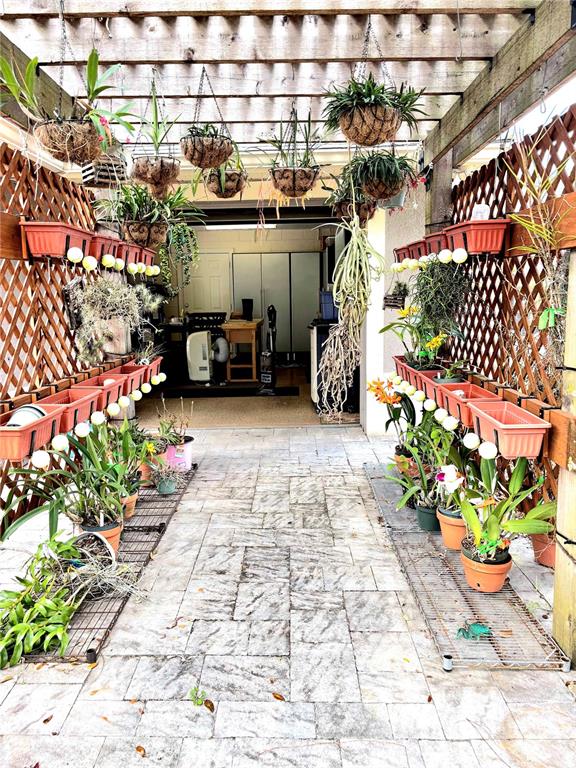 214 Chestnut Ridge Street Winter Springs, FL 32708 - Photo 67 of 68 a view of a chairs and tables in a outdoor space
