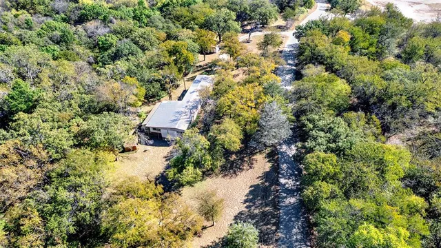a view of a house with a tree