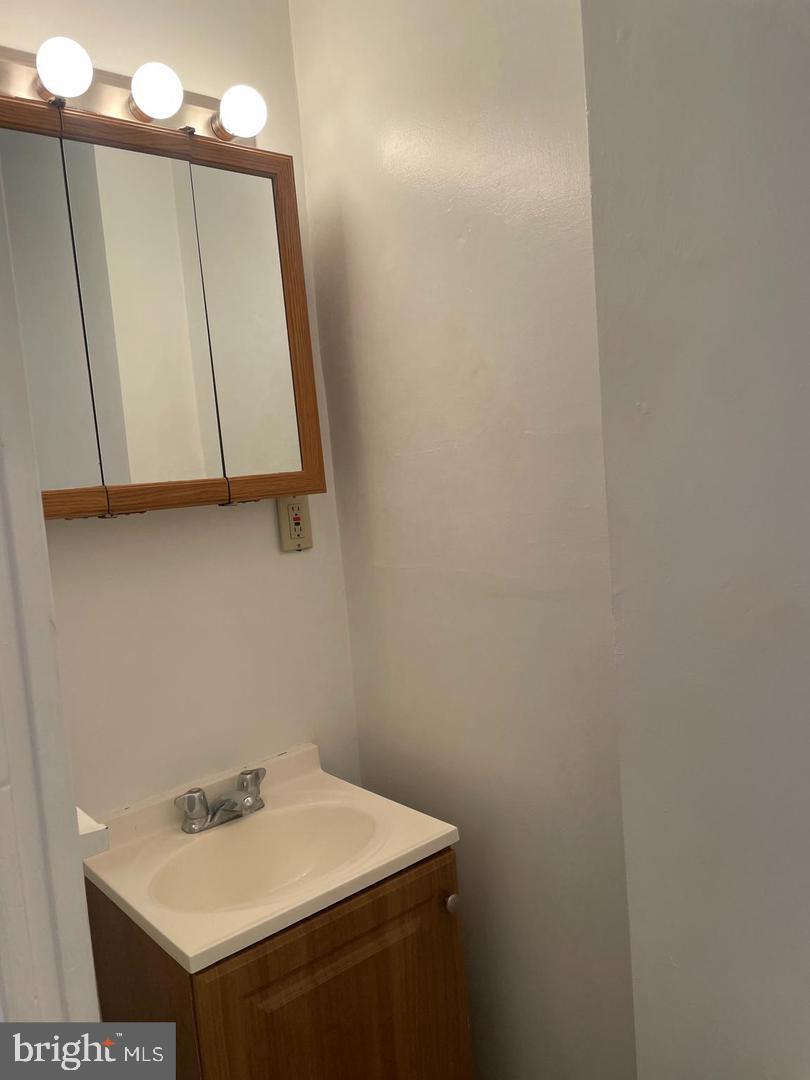 67 Sunshine Road Upper Darby, PA 19082 - Photo 12 of 21 a bathroom with a sink and a mirror
