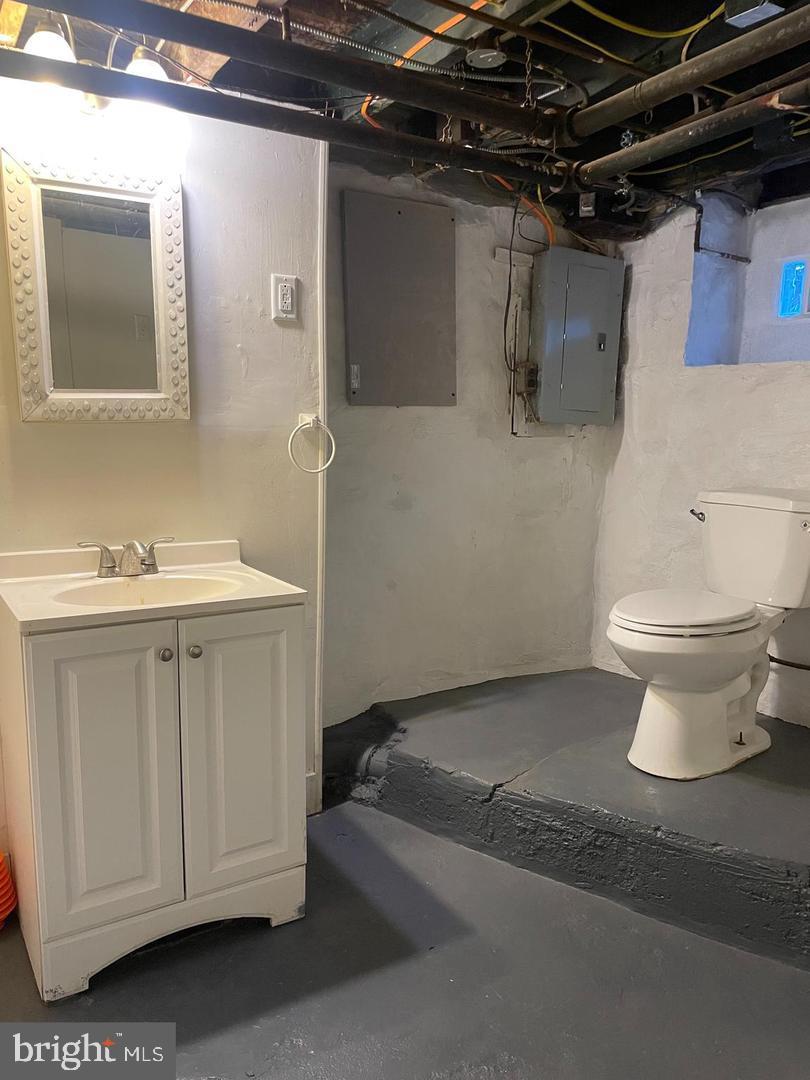 67 Sunshine Road Upper Darby, PA 19082 - Photo 19 of 21 a bathroom with a toilet sink and mirror