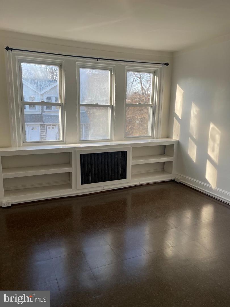 67 Sunshine Road Upper Darby, PA 19082 - Photo 9 of 21 a view of room with wooden floor and fan