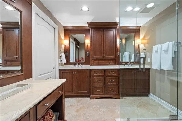 a bathroom with a sink and a large mirror