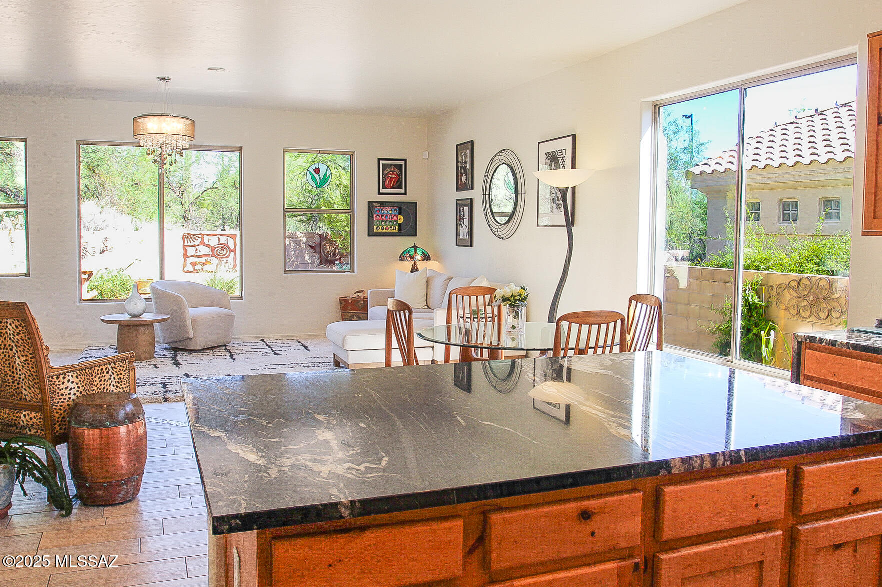 5202 Spring View Drive Tucson, AZ 85749 - Photo 19 of 49 a kitchen with a table chairs and window
