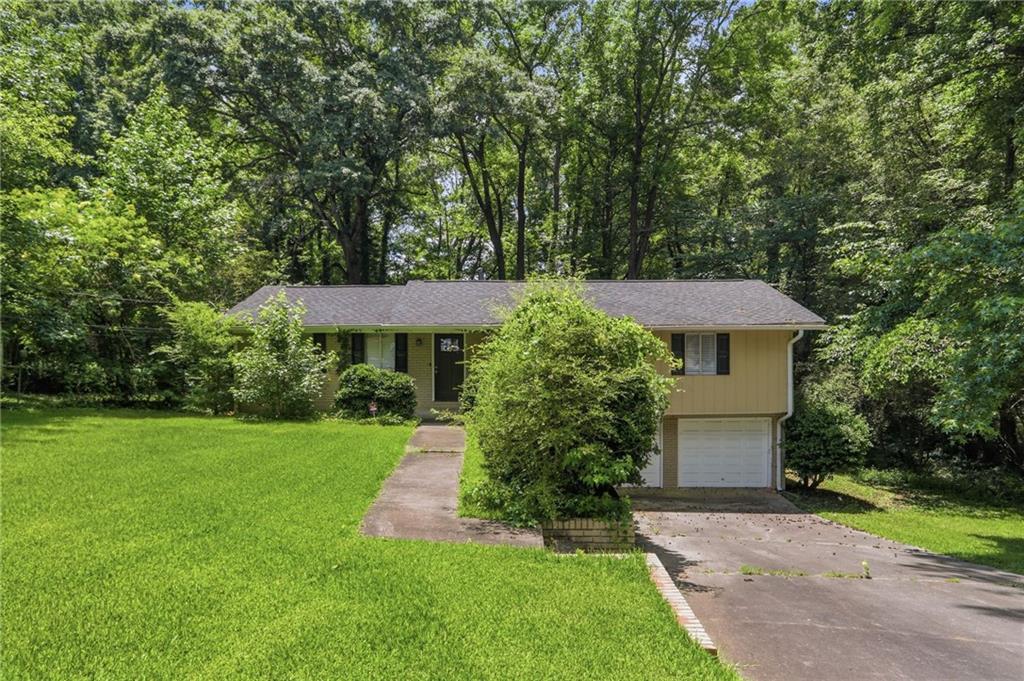 4505 Wonder Valley Trail Decatur, GA 30034 - Photo 1 of 34 a front view of a house with a yard