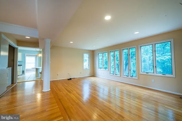 a view of an empty room and a window