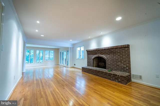 a view of a bathroom with a tub sink and mirror