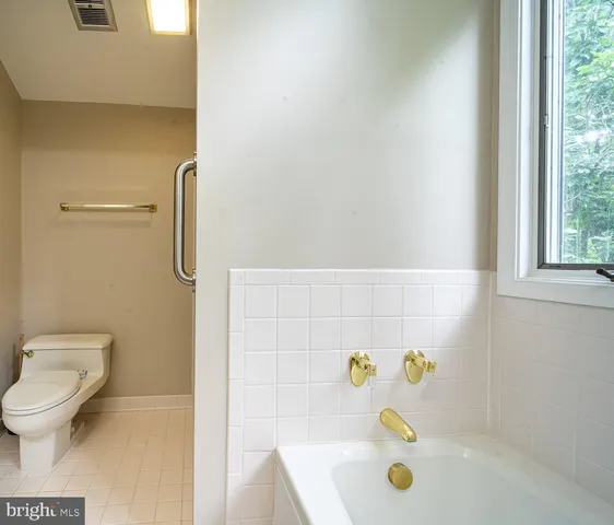 a view of kitchen and kitchen with furniture and window