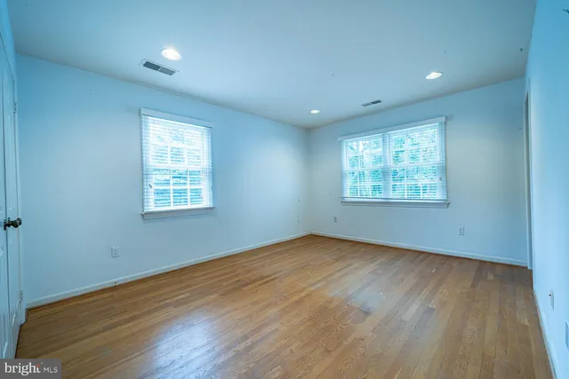 a view of a balcony with wooden floor