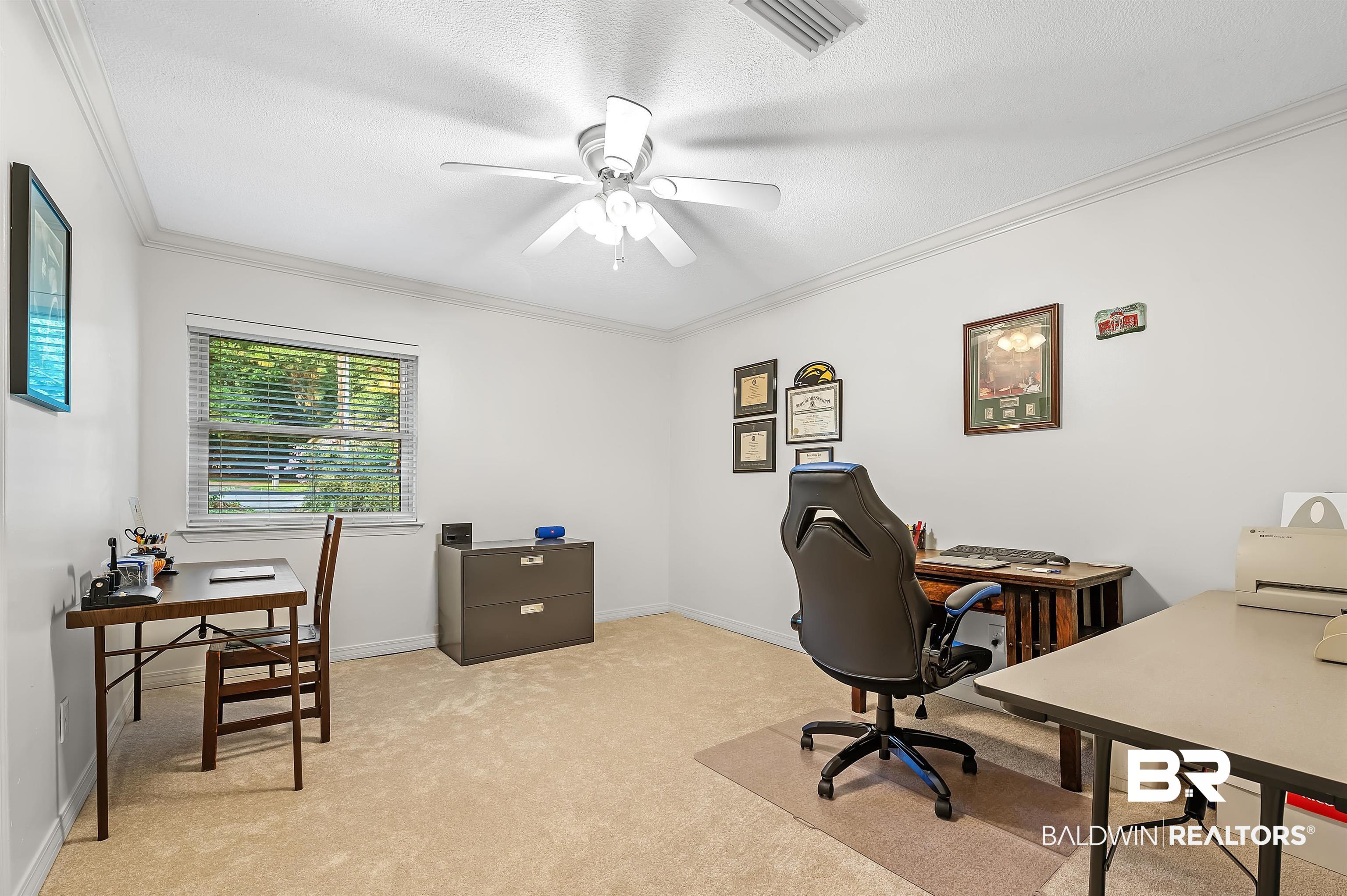 104 James Circle Daphne, AL 36526 - Photo 55 of 62 Office area with a textured ceiling, ceiling fan, ornamental molding, and light colored carpet