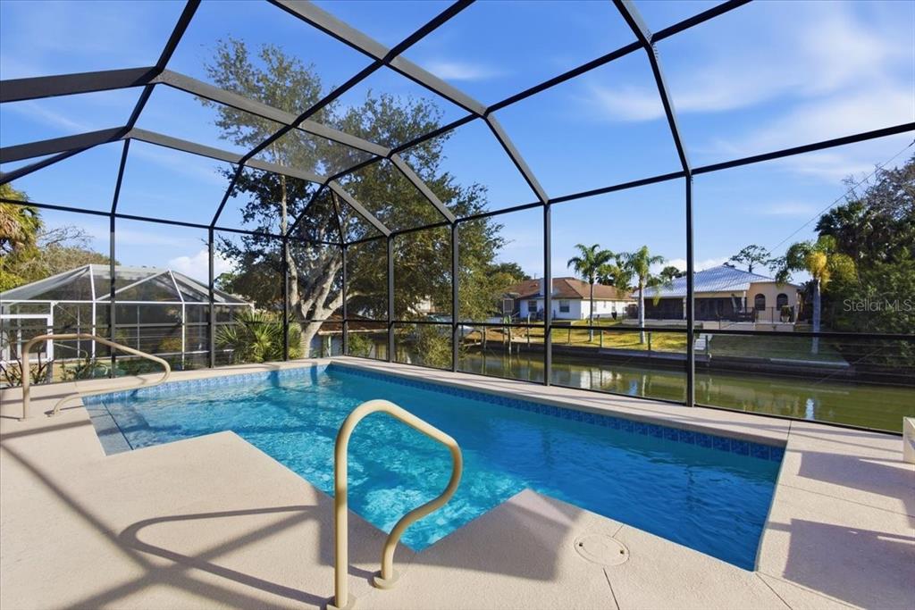 8 Cochran Lane Palm Coast, FL 32137 - Photo 11 of 40 a view of a swimming pool with a chairs