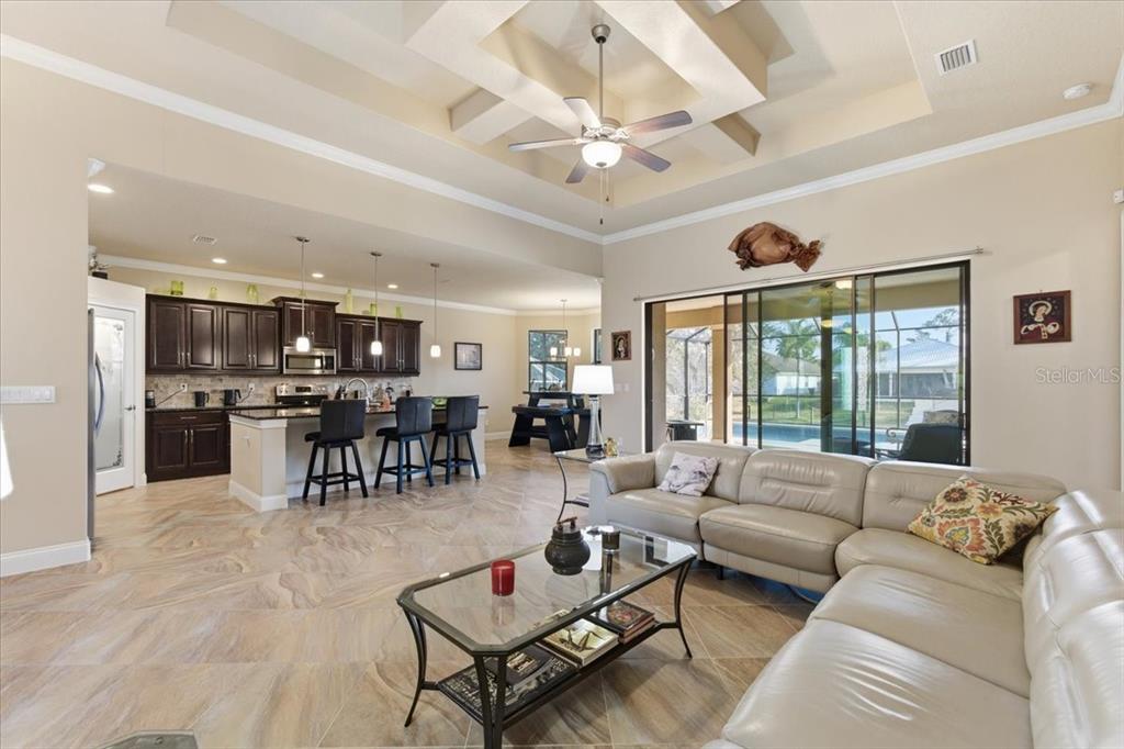8 Cochran Lane Palm Coast, FL 32137 - Photo 15 of 40 a living room with furniture kitchen and a large window