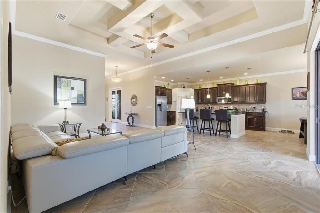 8 Cochran Lane Palm Coast, FL 32137 - Photo 16 of 40 a living room with furniture and kitchen view