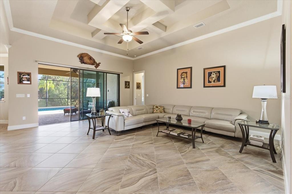 8 Cochran Lane Palm Coast, FL 32137 - Photo 17 of 40 a living room with furniture and a large window