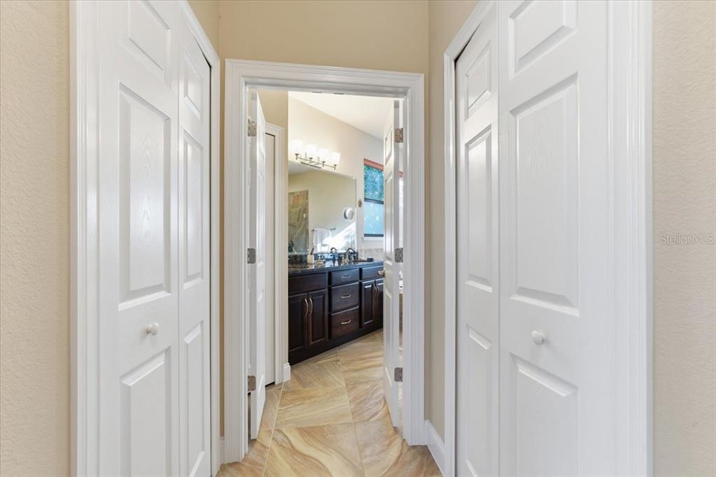 8 Cochran Lane Palm Coast, FL 32137 - Photo 20 of 40 a bathroom with a glass door shower and a sink