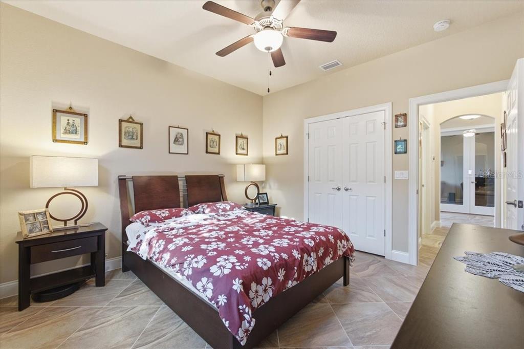 8 Cochran Lane Palm Coast, FL 32137 - Photo 24 of 40 a bedroom with a bed and wooden floor